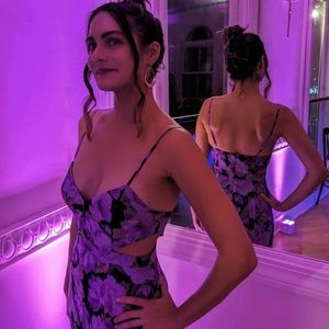 Fame and Partners sienna size waist cutout gown with a fit like the small size.